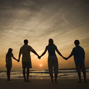 customized workshops - family holding hands at sunset - family recovery institute